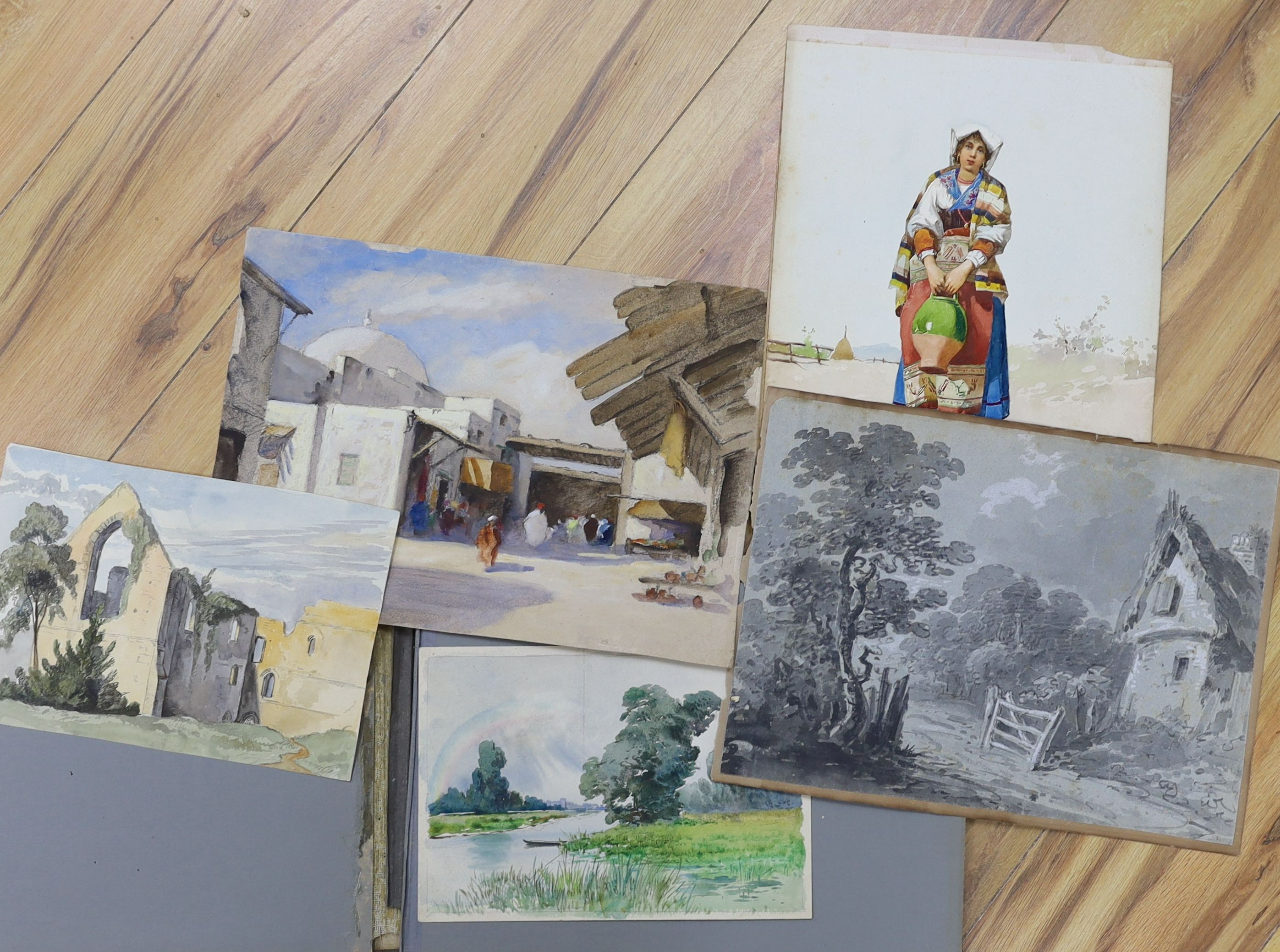 An album of mainly 19th century watercolour landscapes, various artists but including a portrait of an Italian woman monogrammed FG, 33 x 25cm and a Victor Wellersley, North African town scene, 25 x 35cm